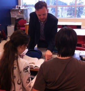 Mr. Russell providing feedback to his students