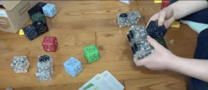 hands manipulating cubelets